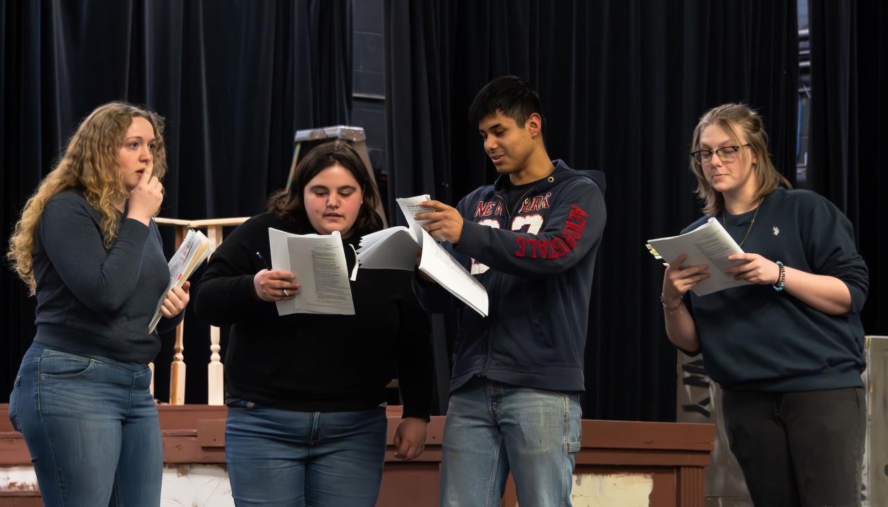 actors on stage reading transcript