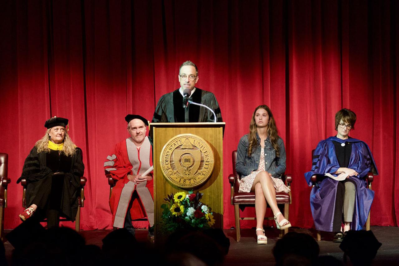 Dean of Mansfield campus Jason Opal speaking on stage at convocation