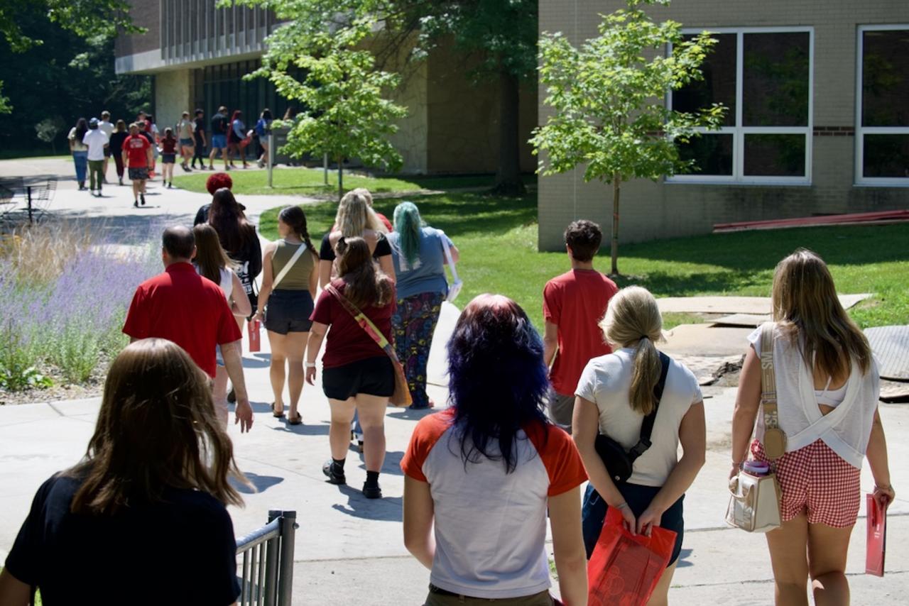 Group of students walking outside on campus
