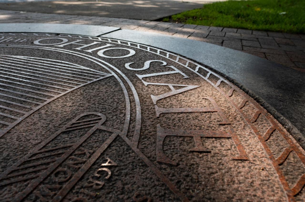 Picture of the Ohio State University seal on the ground on Columbus campus