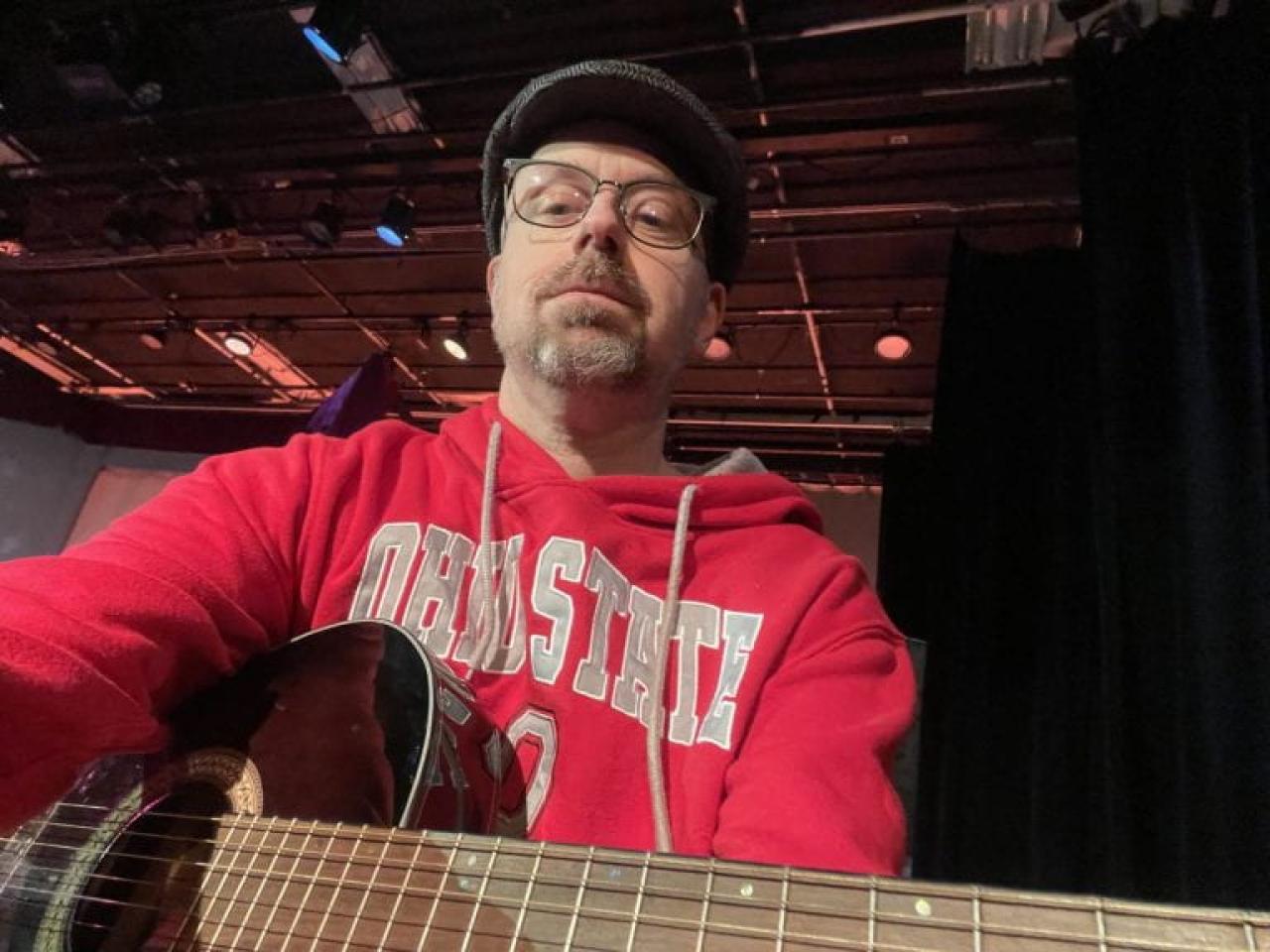 Mantra Das posing with a guitar