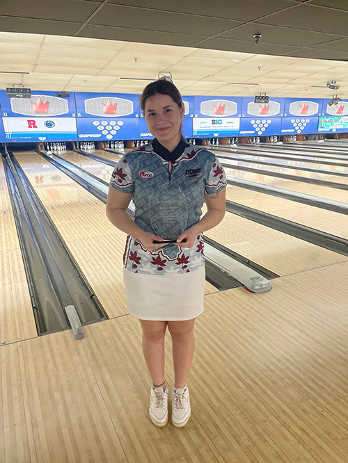 Diana Ceban posing with a bowling team award