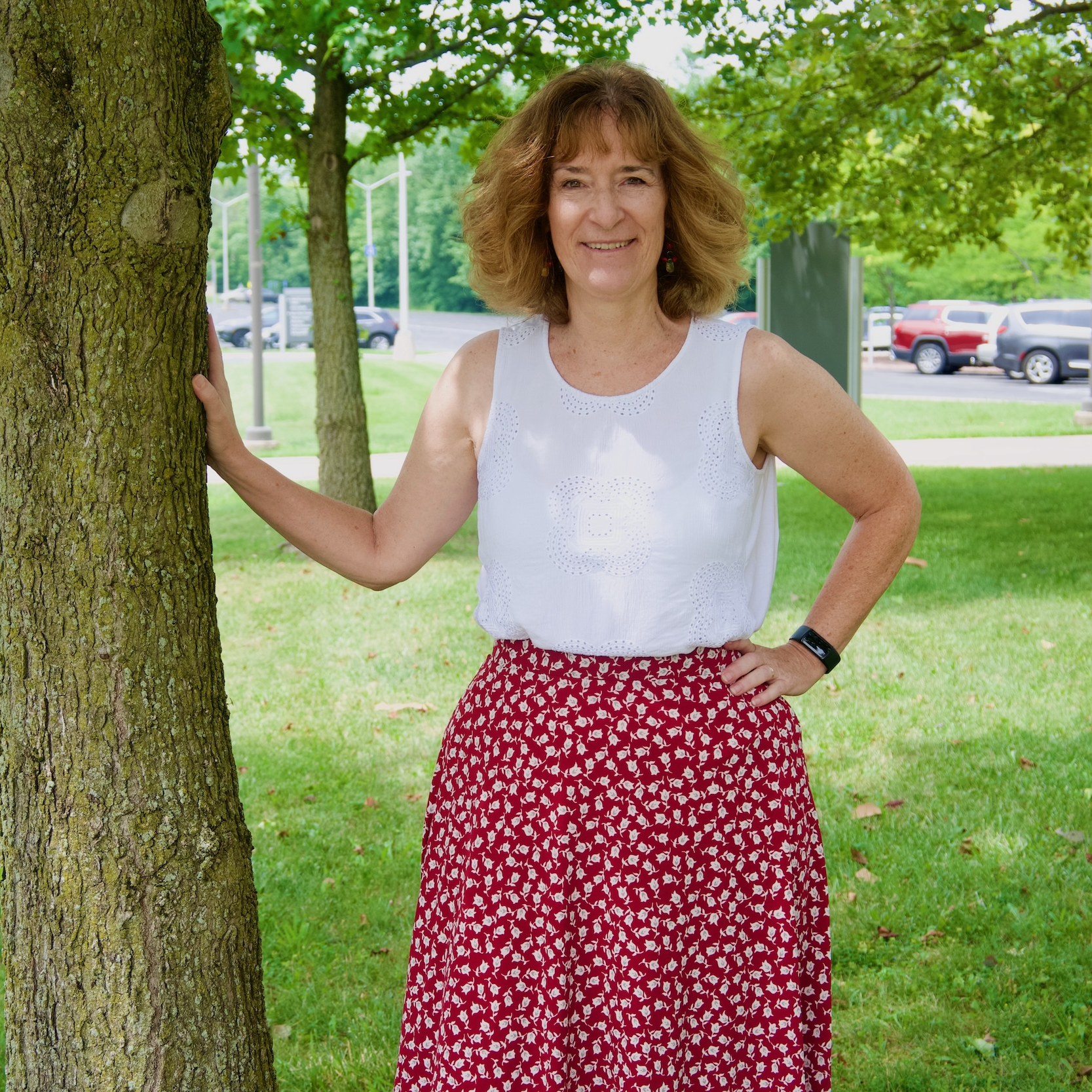 Heather Tanner posing outdoors next to a tree
