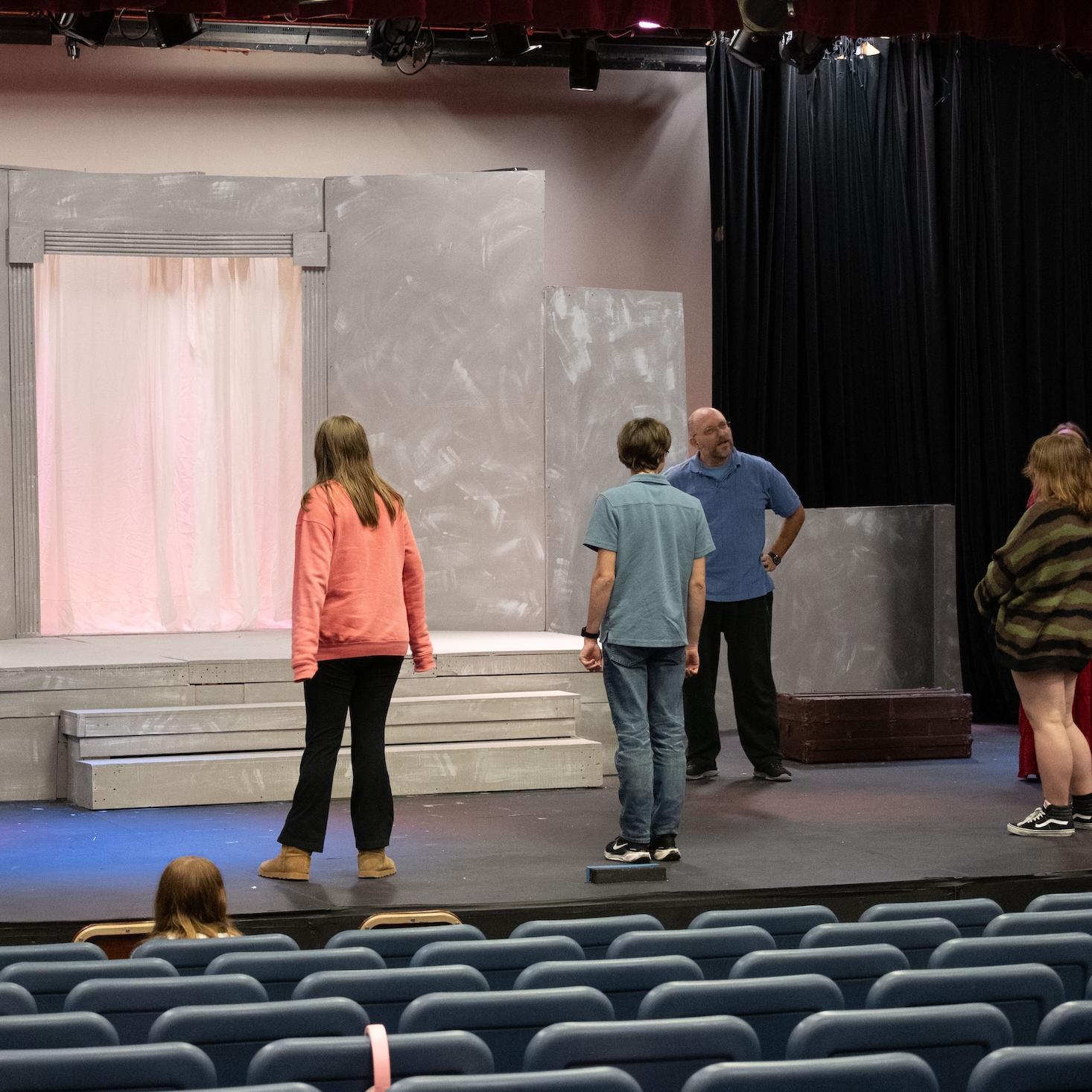 student actors on stage for the performance for Medea