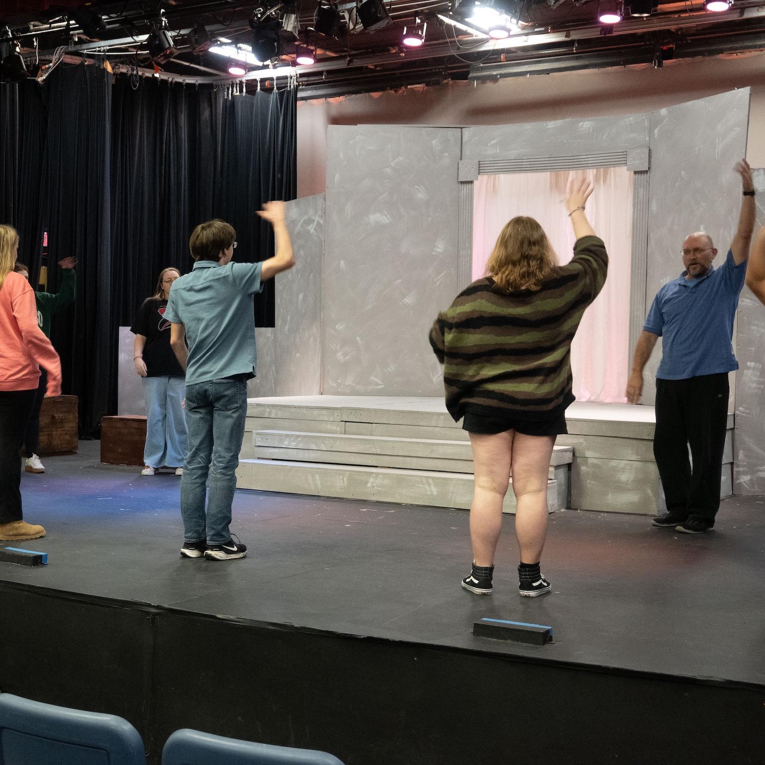 student actors on stage for the performance for Medea