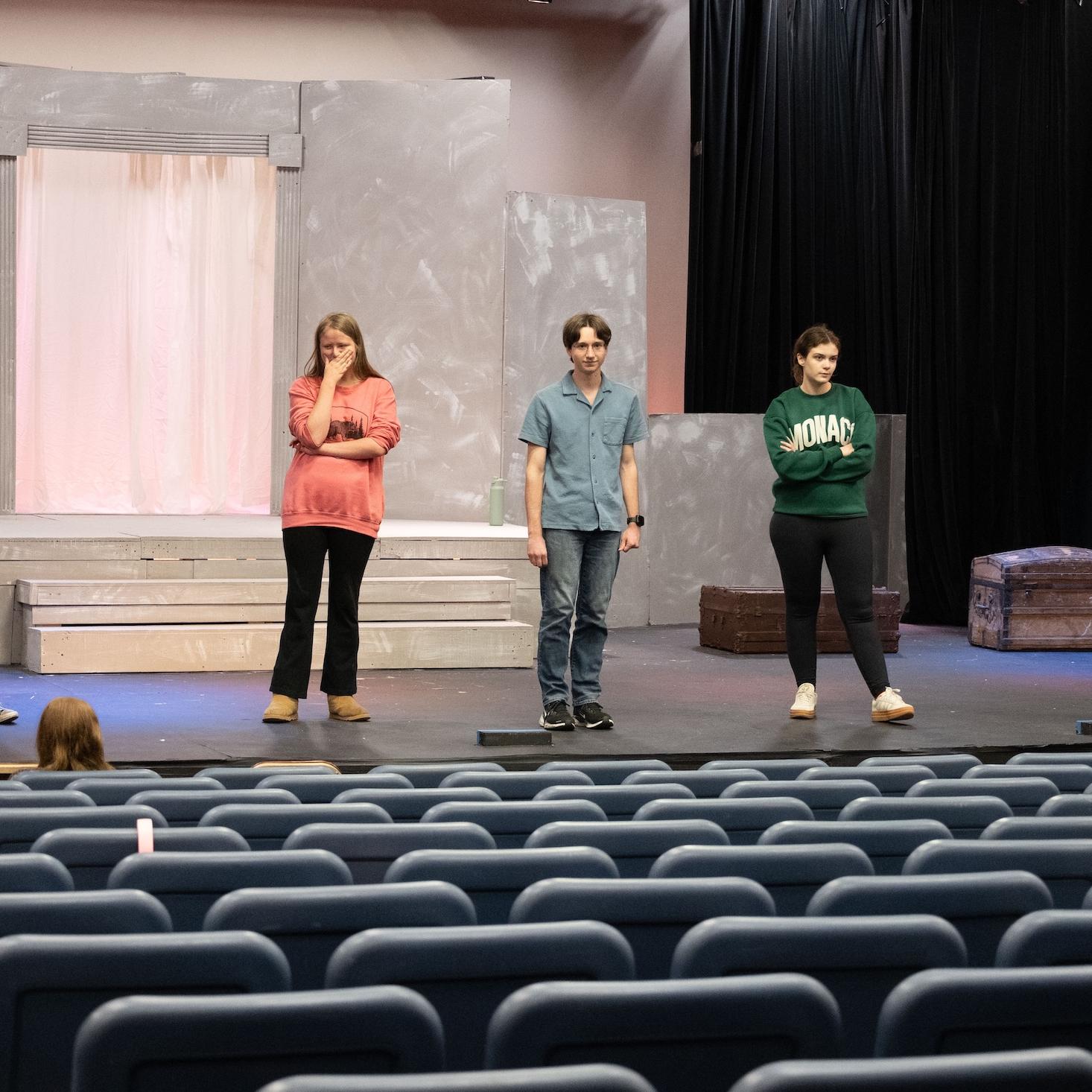 student actors on stage for the performance for Medea