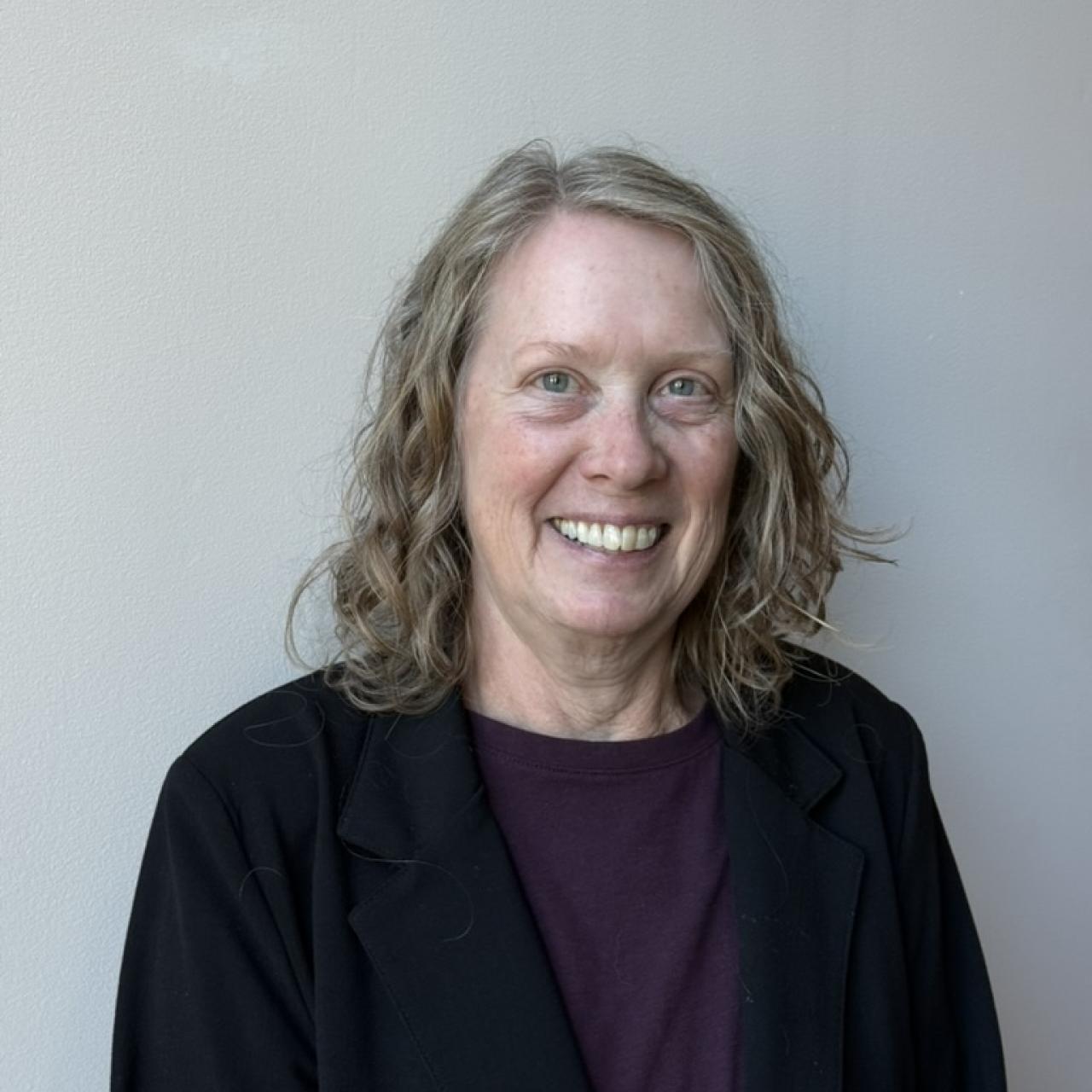 headshot of Debe Adams