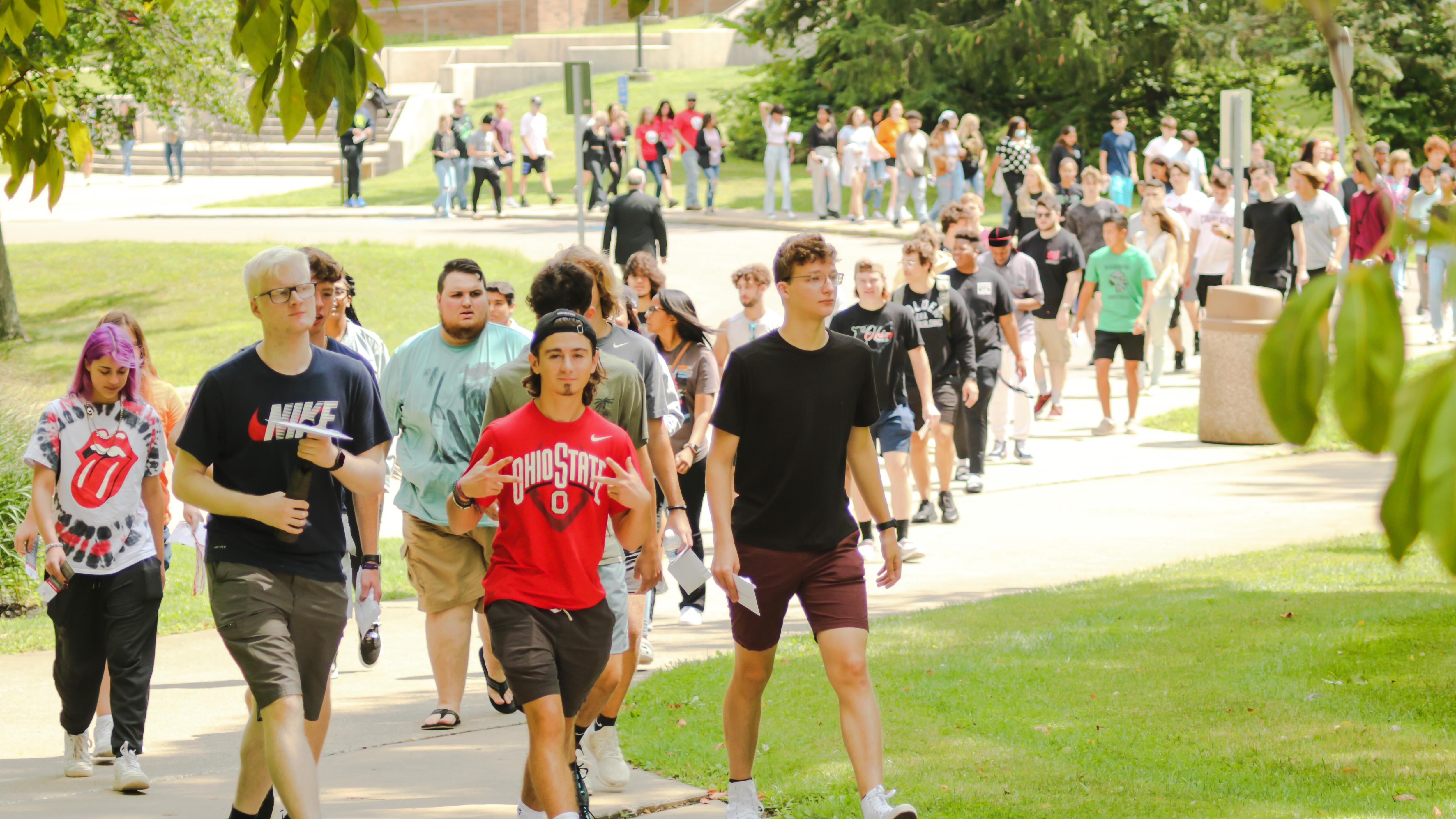 Group of students walking across campus