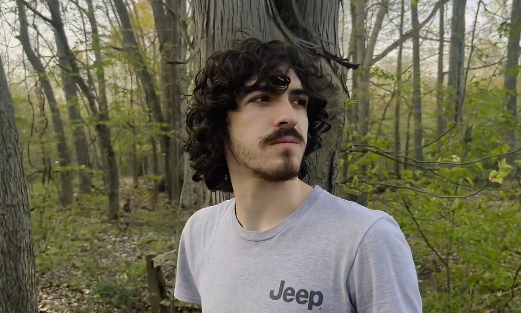 headshot of a male wearing a Jeep shirt