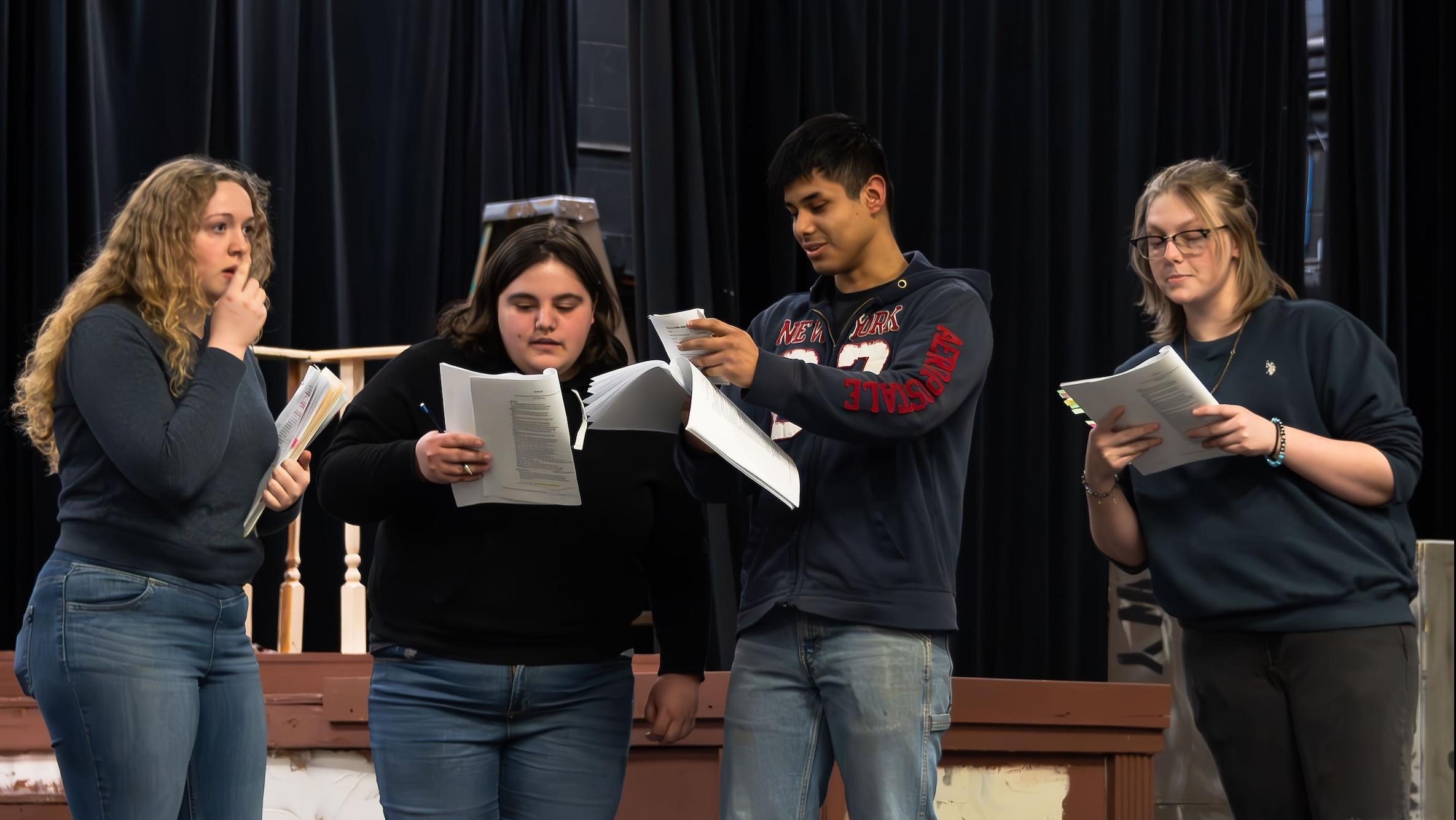 actors on stage reading transcript