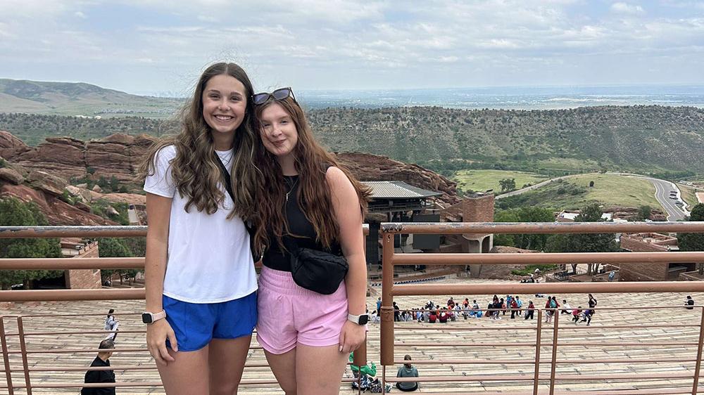 two female students posing outdoors