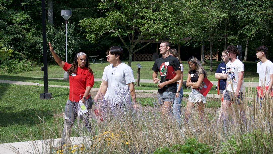 students walking outdoors on campus