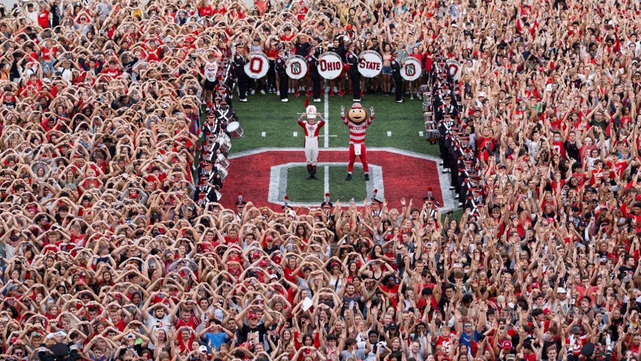 football field brutus and drum major and crowd