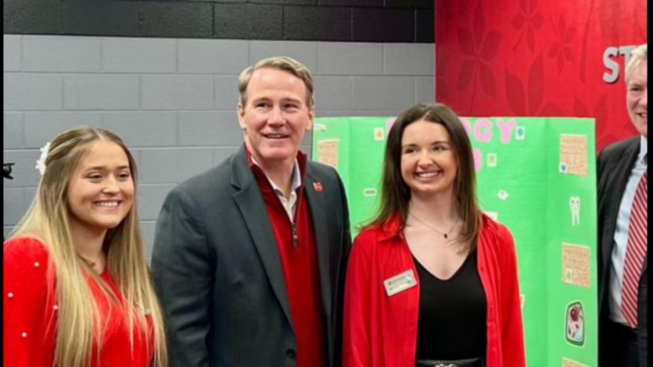 Lt. governor Jon Husted posing for a picture with two women