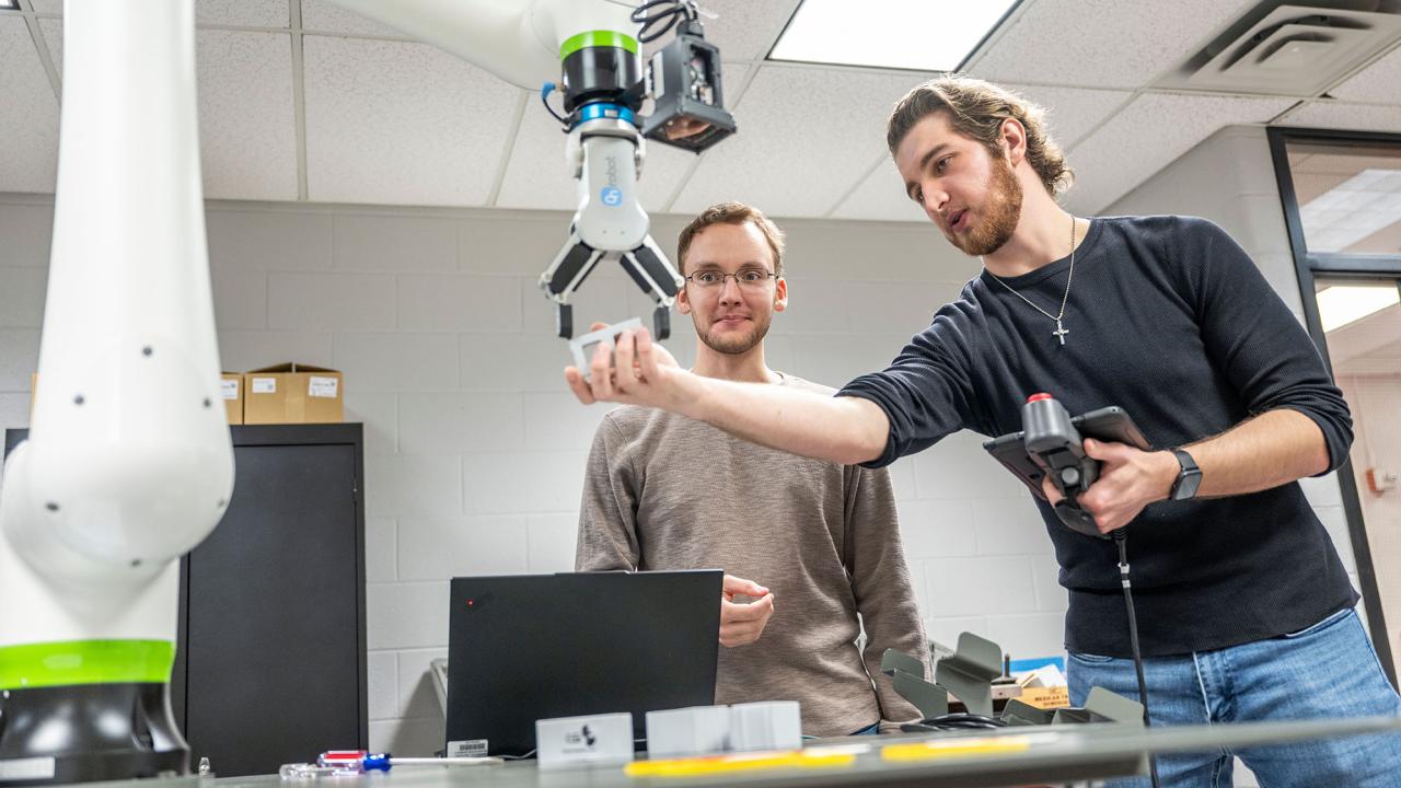 two male students in an engineering technology lab
