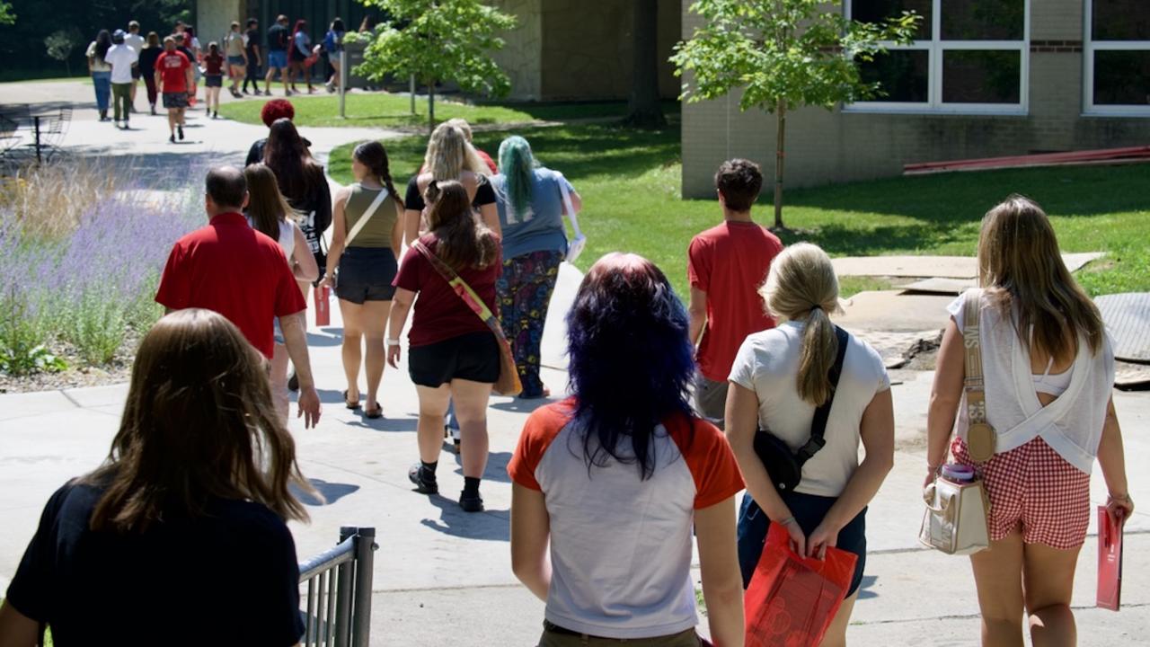 Group of students walking outside on campus