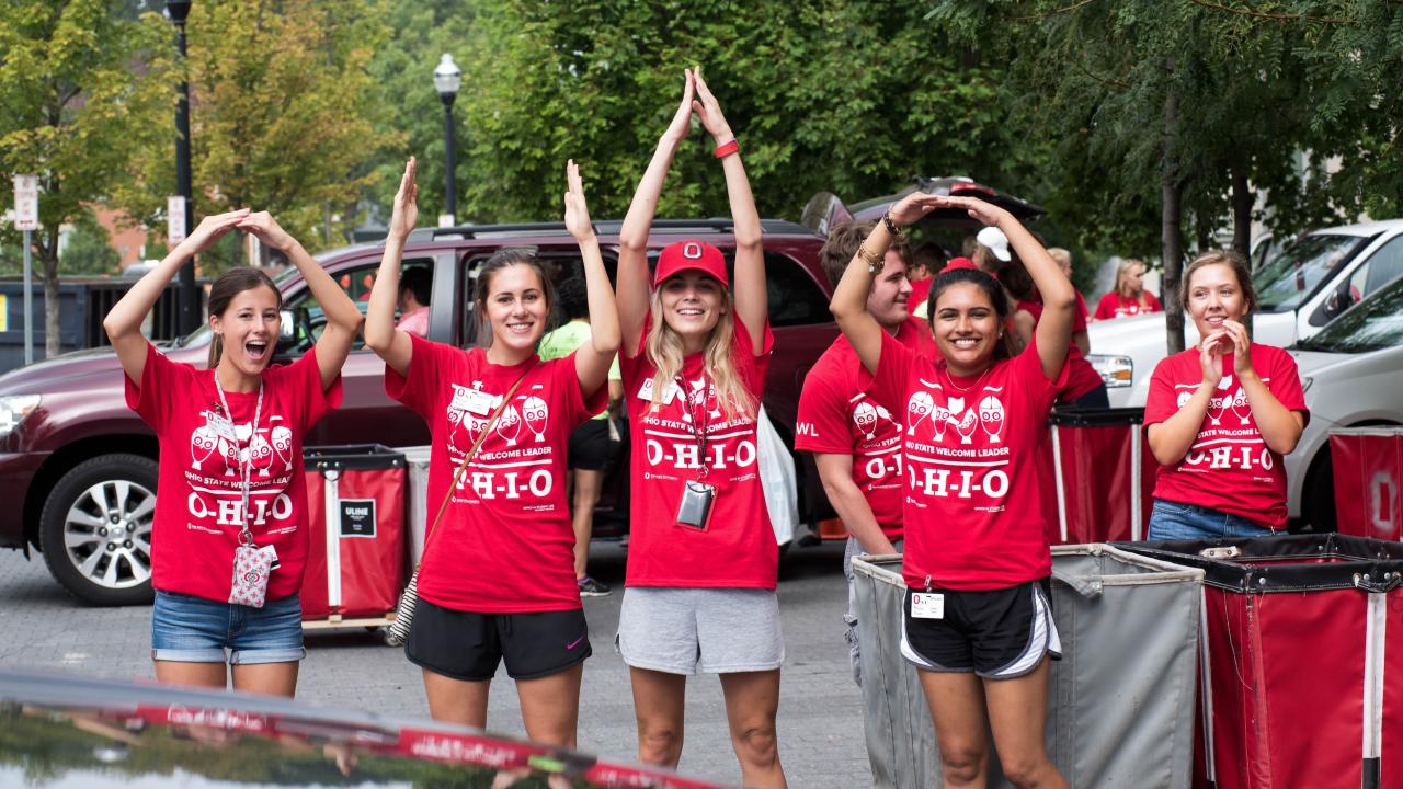 Students spelling out Ohio with their arms