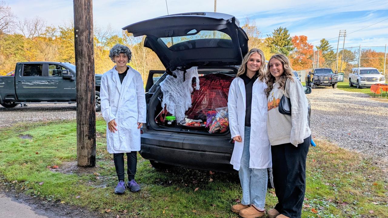 Halloween trunk or treat handing out candy