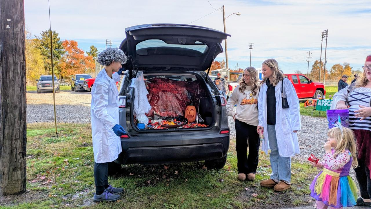 Halloween trunk or treat handing out candy