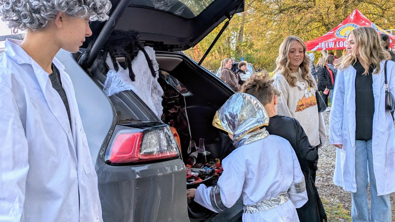 Halloween trunk or treat handing out candy